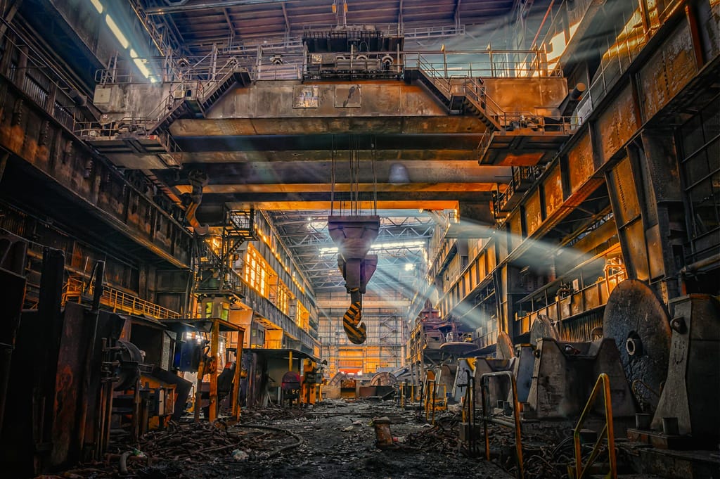 KSRML steel mill in operation, glowing molten metal in the foreground